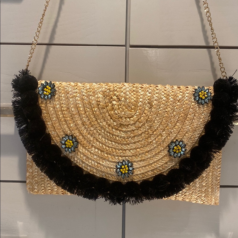 Elegant Straw Clutch with Black Accents